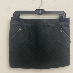 BCBG Black faux leather mini skirt w-2 small pockets w-zippers on front